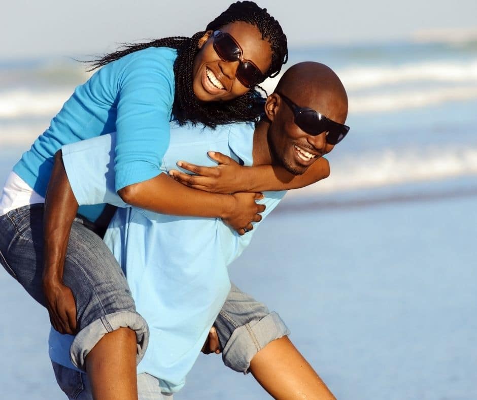 Couple on the beach in winter clothing