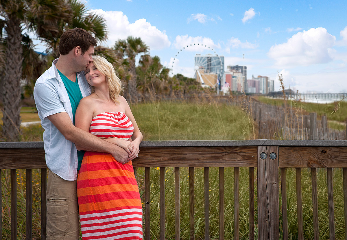 Man kissing woman's forehead