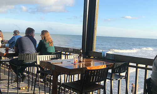 Couple eating overlooking the Ocean