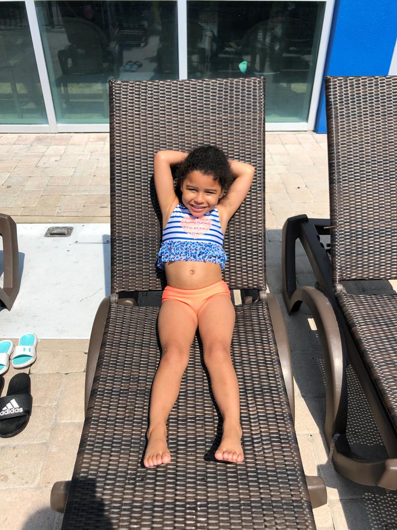 Little girl relaxing on chair