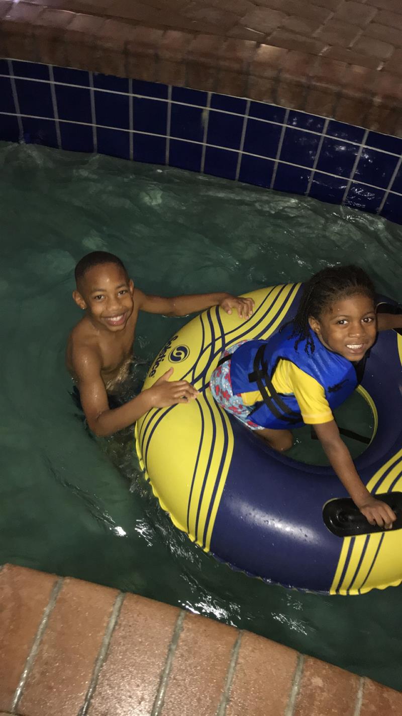Kids in pool tube
