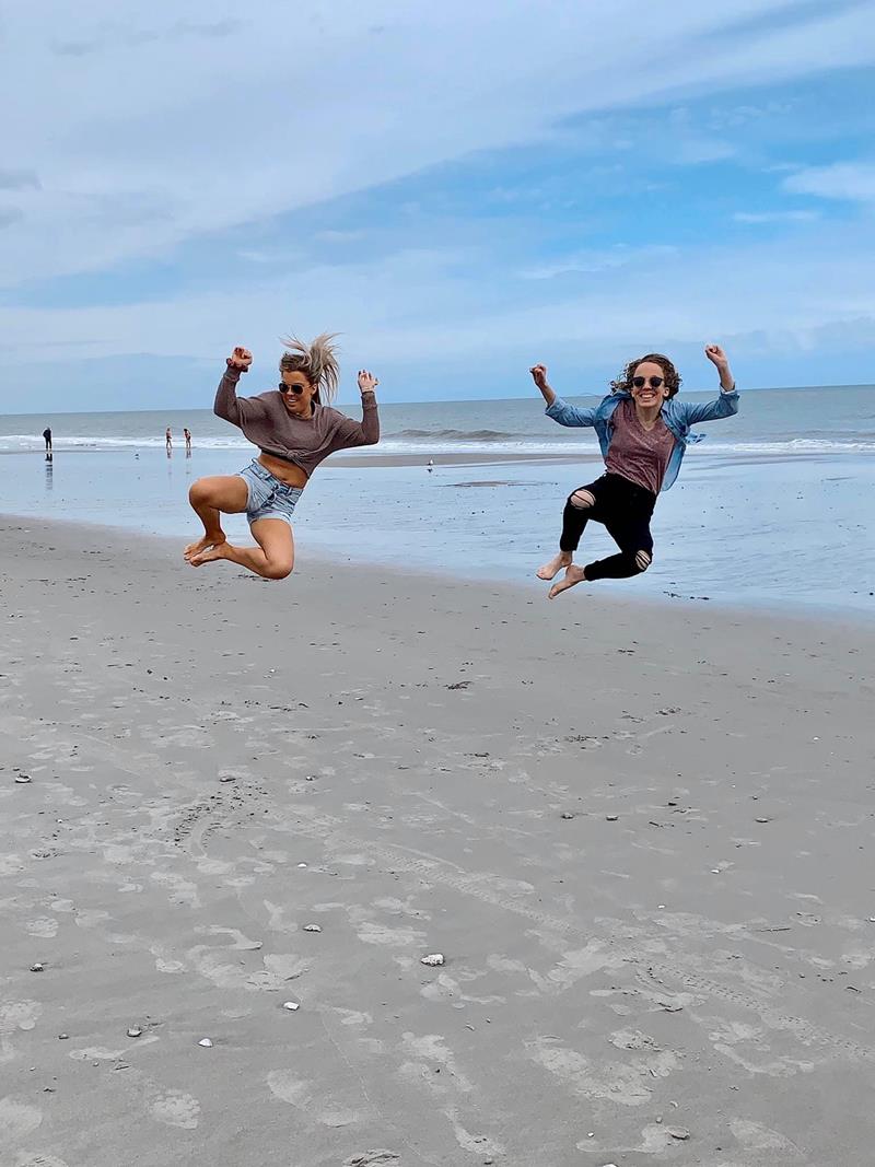 Girls jumping on the beach