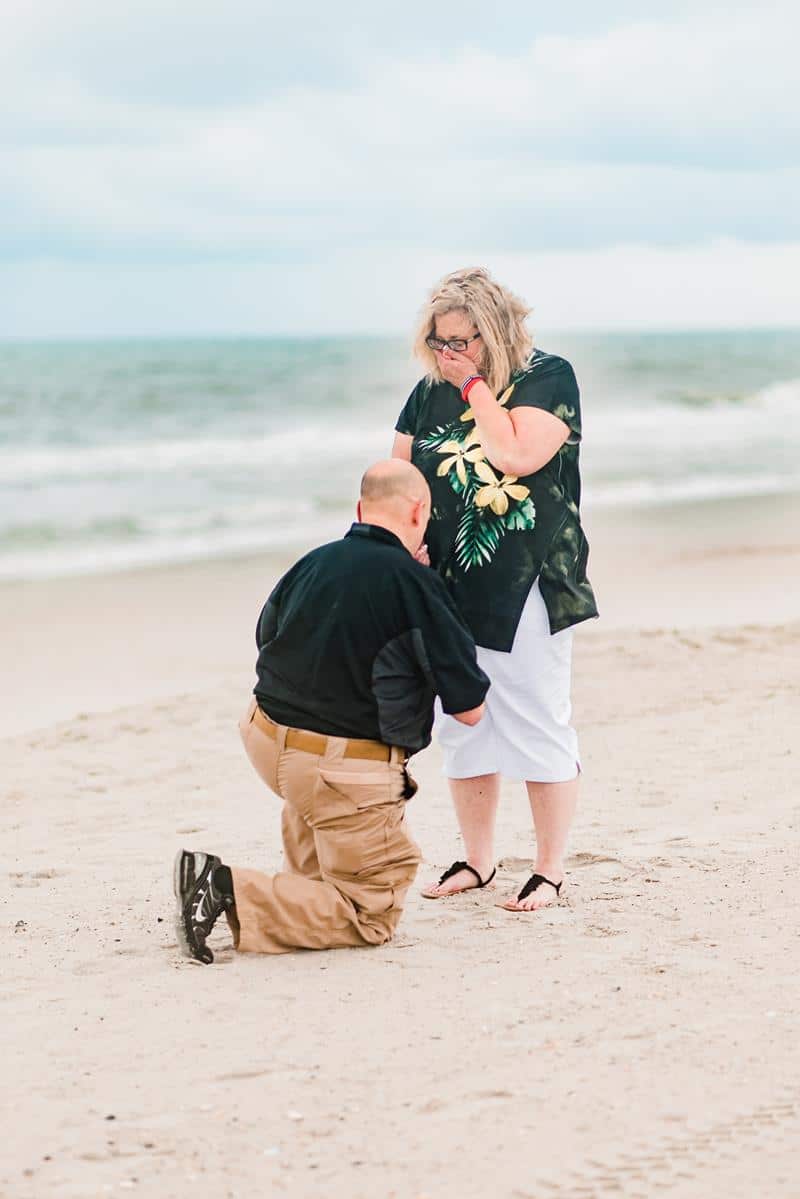 Man proposing on the beach