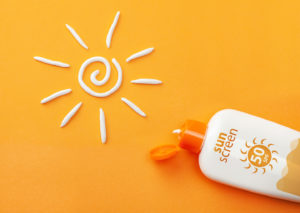 Sunscreen on orange background