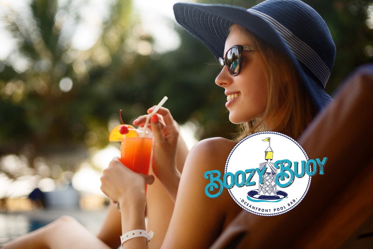 Boozy Buoy Oceanfront Pool Bar Woman Sipping A Drink By The Pool 