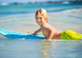 Boy-Surf-At-The-Beach-shutterstock_162352100-scaled-1.jpg Boy-Surf-At-The-Beach-shutterstock_162352100-scaled-1.jpg